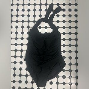 One piece miracle suit with underwire.